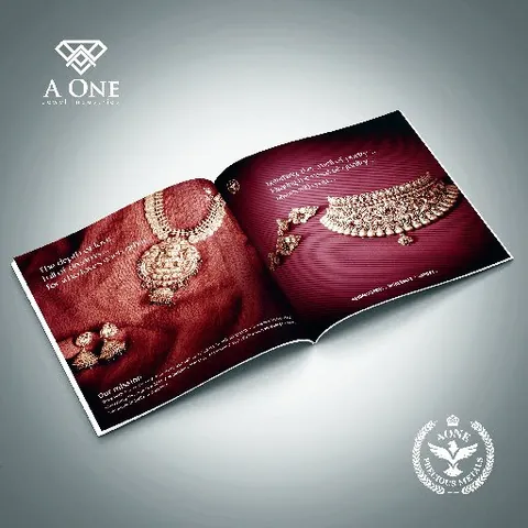 A One brochure spread: gold necklaces on deep red