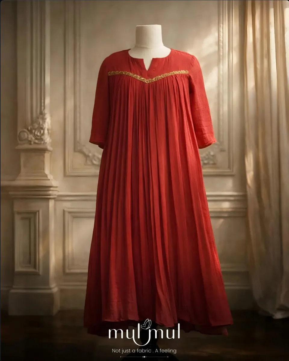 Mulmul poster: a red cotton dress on a hanger in soft light