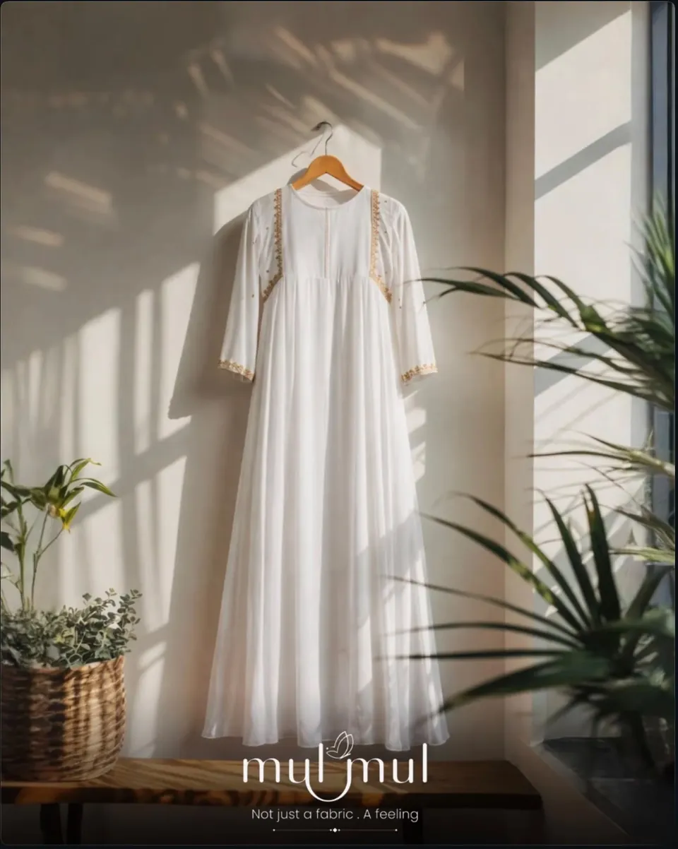 Mulmul poster: a white dress hanging in a sunlit room